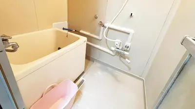 a bathroom with a tub and a pink toilet at Espoir - Vacation STAY 42528v in Tokyo