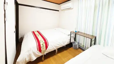 a small bedroom with a bed and a window at Espoir - Vacation STAY 42518v in Tokyo