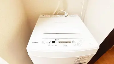 a white washing machine sitting in a corner at Espoir - Vacation STAY 42428v in Tokyo