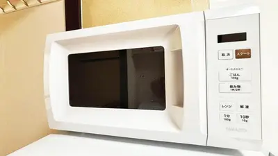 a white microwave oven sitting on top of a counter at Espoir - Vacation STAY 42513v in Tokyo
