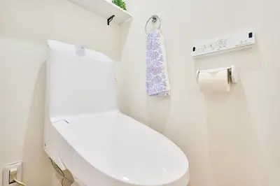 a bathroom with a white toilet and a roll of toilet paper at EK Stay Tenku-no-ki \u5929\u7a7a\u306e\u6a39 Asakusa SkyTree Area 4BR Chic House Near Station in Tokyo