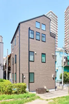 a large apartment building with a gray at EK Stay Tenku-no-ki \u5929\u7a7a\u306e\u6a39 Asakusa SkyTree Area 4BR Chic House Near Station in Tokyo