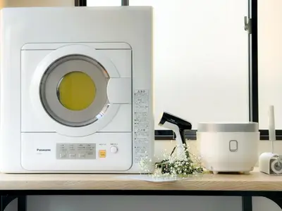 a white washing machine sitting on a shelf at Mando Hotel \u6b65\u884c\u81f3 Asakusa Ueno in Tokyo