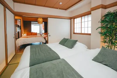 two beds in a room with two beds at Otter Stay - Ikebukuro in Tokyo