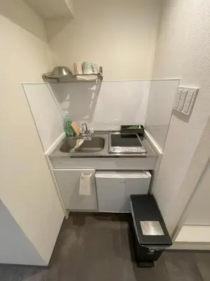 a small kitchen with a sink and a stove at yuki shinjuku okubo 5F 502-SJ0044 in Tokyo