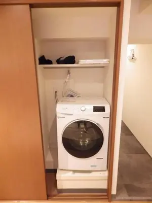 a washer and dryer in a small room at yuki shinjuku okubo 5F 502-SJ0044 in Tokyo