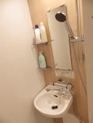 a bathroom with a sink and a mirror at yuki shinjuku okubo 5F 502-SJ0044 in Tokyo