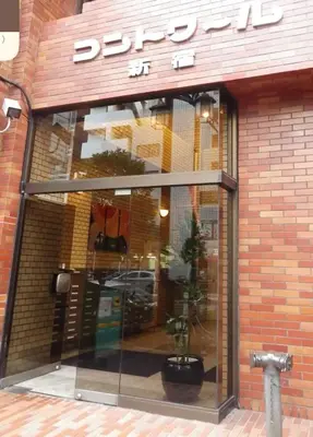 a store front with a reflection of a car in the window at yuki shinjuku okubo 5F 502-SJ0044 in Tokyo