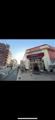 a store on a street with motorcycles parked in front of it at \u685c\u306e\u5c4b25\u5e73\u65b9\u5927\u5e8a\u623fSakura House 25 square meter king size bed room202 in Tokyo