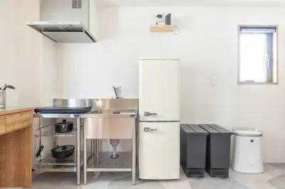a kitchen with a refrigerator and a sink at The best Nakano house 4 minutes to station in Tokyo