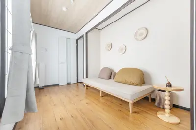 a living room with a couch and a table at A unique cozy townhouse perfect for up to 5 guests in Tokyo