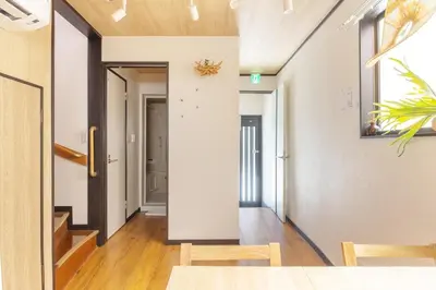 a hallway with a table and chairs in a house at A unique cozy townhouse perfect for up to 5 guests in Tokyo