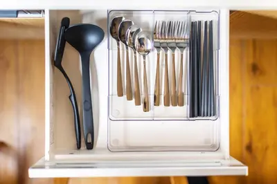 a drawer filled with utensils on a shelf at A unique cozy townhouse perfect for up to 5 guests in Tokyo