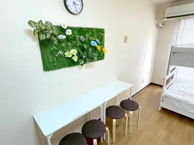 a small room with a white table and stools at Shinjyuku Kabukisho vacation stay self check in in Tokyo