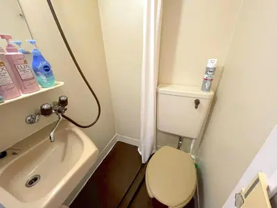 a small bathroom with a toilet and a sink at Shinjyuku Kabukisho vacation stay self check in in Tokyo