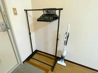 a metal rack in the corner of a room at Shinjyuku Kabukisho vacation stay self check in in Tokyo