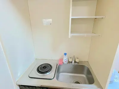 a small kitchen with a sink in a small room at Shinjyuku Kabukisho vacation stay self check in in Tokyo
