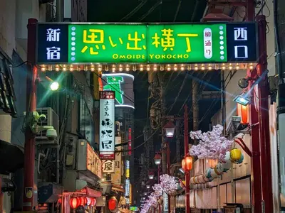 a street with signs in an asian city at night at Shinjyuku Kabukisho vacation stay self check in in Tokyo