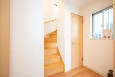 a staircase in a house with wooden floors at Familia Kamata 2 in Tokyo