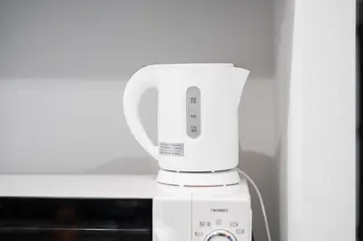 a white blender sitting on top of a microwave at Brand New Apt near Roppongi 4min Walk in Tokyo