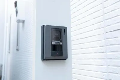 a small tv on the side of a building at SunRise STAY Haruna in Tokyo