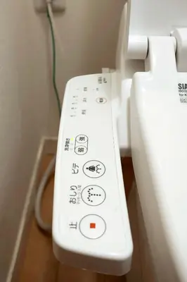 a close up of a white toilet with buttons at SunRise STAY Haruna in Tokyo