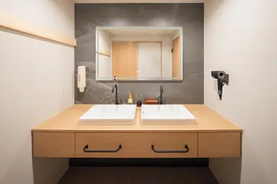 a bathroom with a sink and a mirror at MARUMI HOTEL Uguisudani\u9daf\u8c37 in Tokyo
