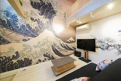a living room with a large painting on the wall at Hokusai Great Wave x Modern Japan in Tokyo
