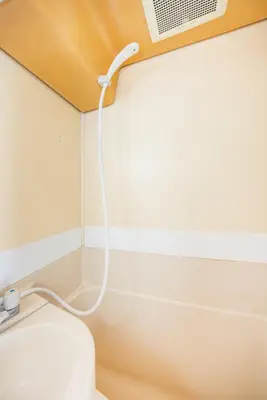 a bathroom with a toilet with a ceiling fan at 603 8 min walk to Ikebukuro 6 min walk to Kanamecho Station25m Max 2 people Direct access to Tokyo, Shinjuku, Shibuya, Ueno in Tokyo