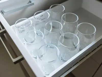a row of wine glasses sitting in a drawer at \u3077\u3075\u304b\u6620\u6708\u6771\u5411\u5cf6 Pufuka Eigetsu Higashi Mukoujim in Tokyo