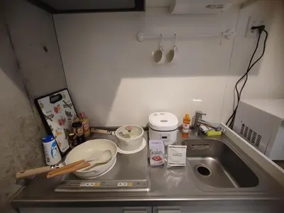 a kitchen counter with a sink and a bowl at 202Room,7-minute walk from Uguisudani Station located on the 2nd floor of an apartment-style building Twin room No elevator in Tokyo