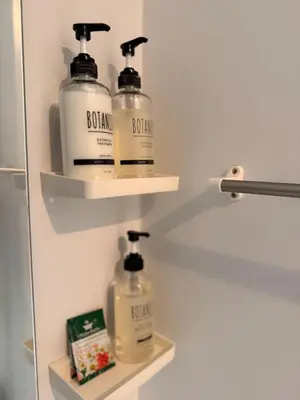 two bottles of soap and moisturizers sit on shelves in a closet at 302Room,7-minute walk from Uguisudani Station located on the 3nd floor of an apartment-style building Twin room No elevator in Tokyo