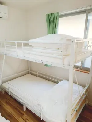 a white bunk bed in a room with a window at Uenton Hotel in Higashi-Mukojima 2F in Tokyo
