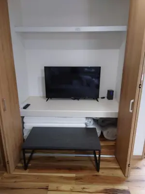 a tv sitting on a shelf in a room at Uenton Hotel in Higashi-Mukojima 2F in Tokyo