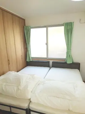 a bed in a room with a window at Uenton Hotel in Higashi-Mukojima 2F in Tokyo
