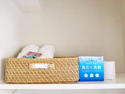 a basket sitting on top of a shelf with a box at F House Shinjuku in Tokyo
