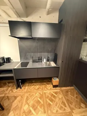 a kitchen with a sink and a counter top at Villa Customa \u30f4\u30a3\u30e9\u30ab\u30b9\u30bf\u30de in Tokyo