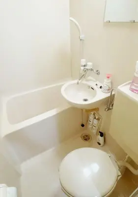 a white bathroom with a sink and a toilet at 101 B&B in Tokyo Kita Ward Convenient Location Near 4 Stations 3 km to Ikebukuro Chinatown in Tokyo