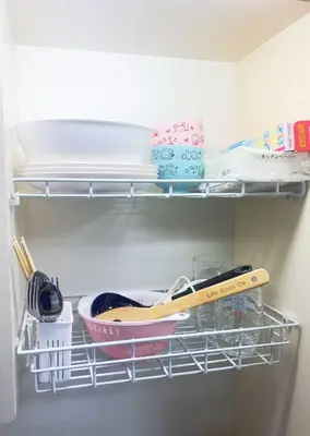 a shelf in a refrigerator with a bowl and utensils at Tokyo Kita-ku B&B, 201, four stations with convenient transportation, 3 km from Chinatown Ikebukuro in Tokyo