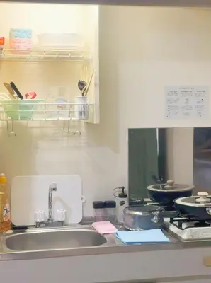 a kitchen counter with a sink and a stove at Tokyo Kita-ku B&B, 202, convenient transportation to four stations, 3 km from Chinatown Ikebukuro in Tokyo