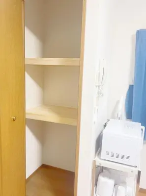 a kitchen shelf with a washing machine on it at Tokyo Kita-ku B&B, 202, convenient transportation to four stations, 3 km from Chinatown Ikebukuro in Tokyo