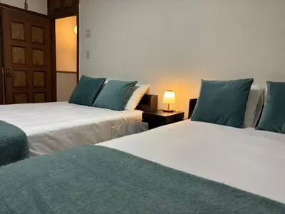two beds sitting next to each other in a room at \u53cc\u693fCamellia House in Tokyo