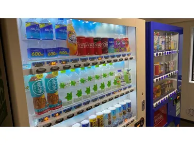 a refrigerator filled with lots of drinks and drinks at Smile Hotel Tokyo Ayase Ekimae - Vacation STAY 14747v in Tokyo