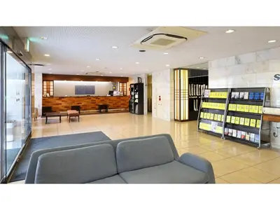 a waiting room with a couch in a store at Smile Hotel Tokyo Ayase Ekimae - Vacation STAY 14741v in Tokyo