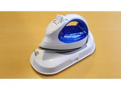 a white iron sitting on top of a table at Smile Hotel Tokyo Ayase Ekimae - Vacation STAY 14722v in Tokyo