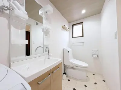 a white bathroom with a sink and a toilet at Belshaart Kamikitazawa - Vacation STAY 20239 in Tokyo