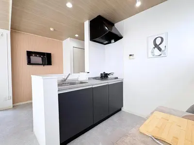a kitchen with a sink and a counter top at Belshaart Kamikitazawa - Vacation STAY 20239 in Tokyo
