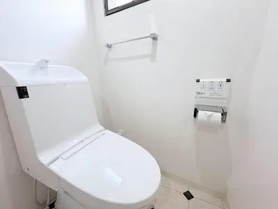 a white bathroom with a toilet and a sink at Belshaart Kamikitazawa - Vacation STAY 20239 in Tokyo