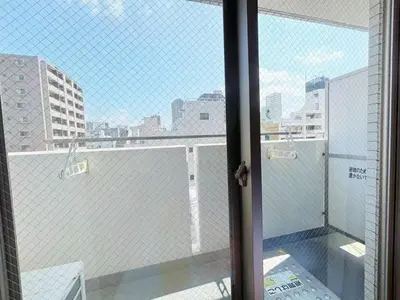 an open door to a balcony with a view of a city at Ars Building 302 - Vacation STAY 41407v in Tokyo
