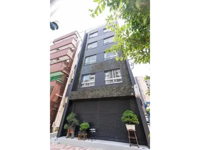 an apartment building with a garage at VOERE KAMEIDO - Vacation STAY 48842v in Tokyo